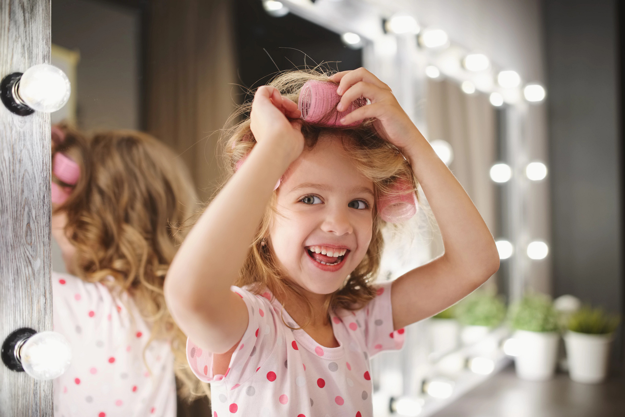 Girl curling her hair