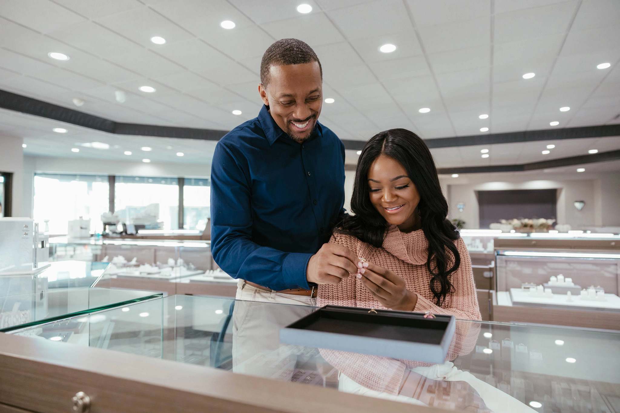 Couple ring shopping at jewelry store
